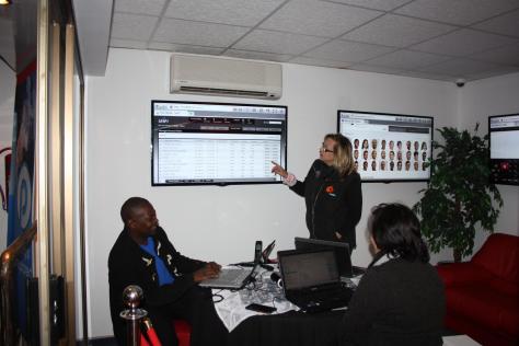 Staff of Paratus Telecom explain the Wi-Fi usage data to Alta Bredenkamp from the Namibia Tourism Expo.